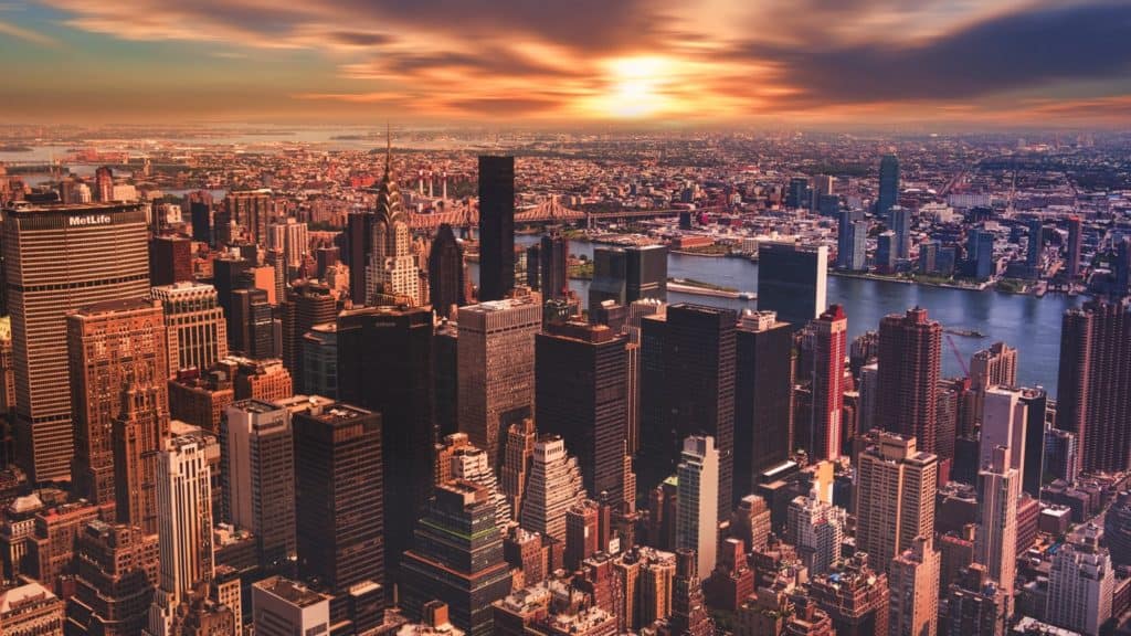 A high angle view of the New York City skyline on a cloudy day.