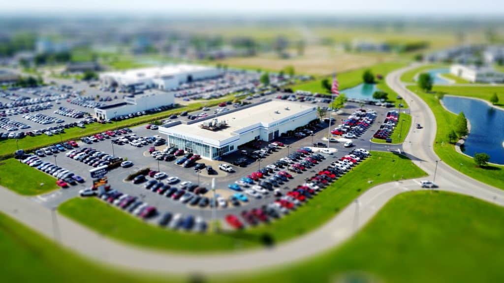An aerial photograph looking over a car dealership.