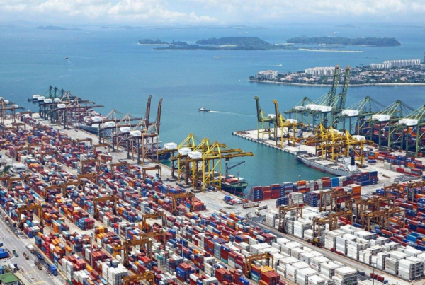 An aerial photo of marine cargo containers at a harbor.