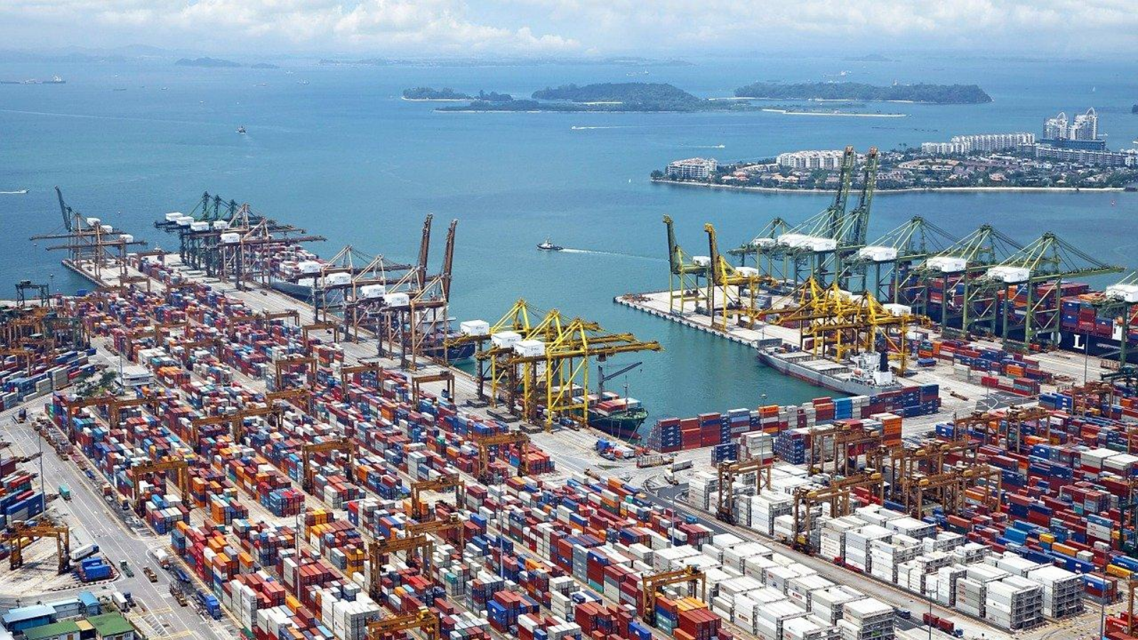 An aerial photo of marine cargo containers at a harbor.