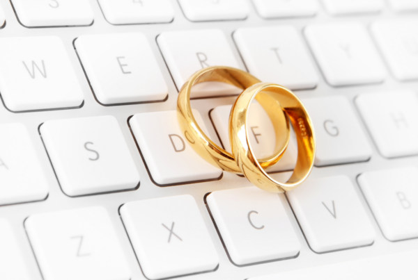 A photo of gold rings on a computer keyboard.