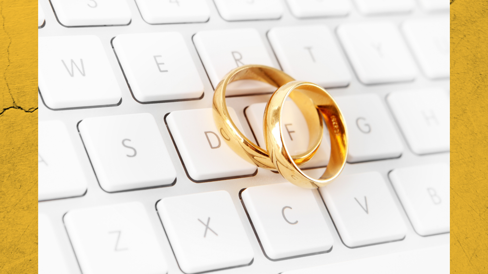 A photo of gold rings on a computer keyboard.