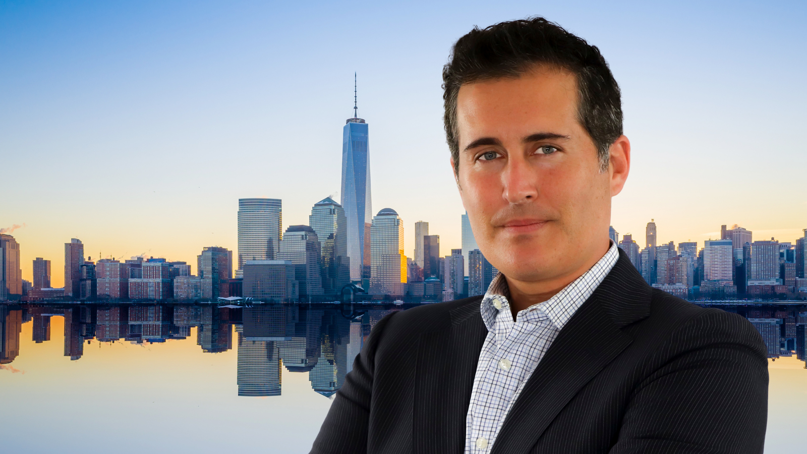 A photo of Michael Lieberman with a background of the NYC skyline at sunrise