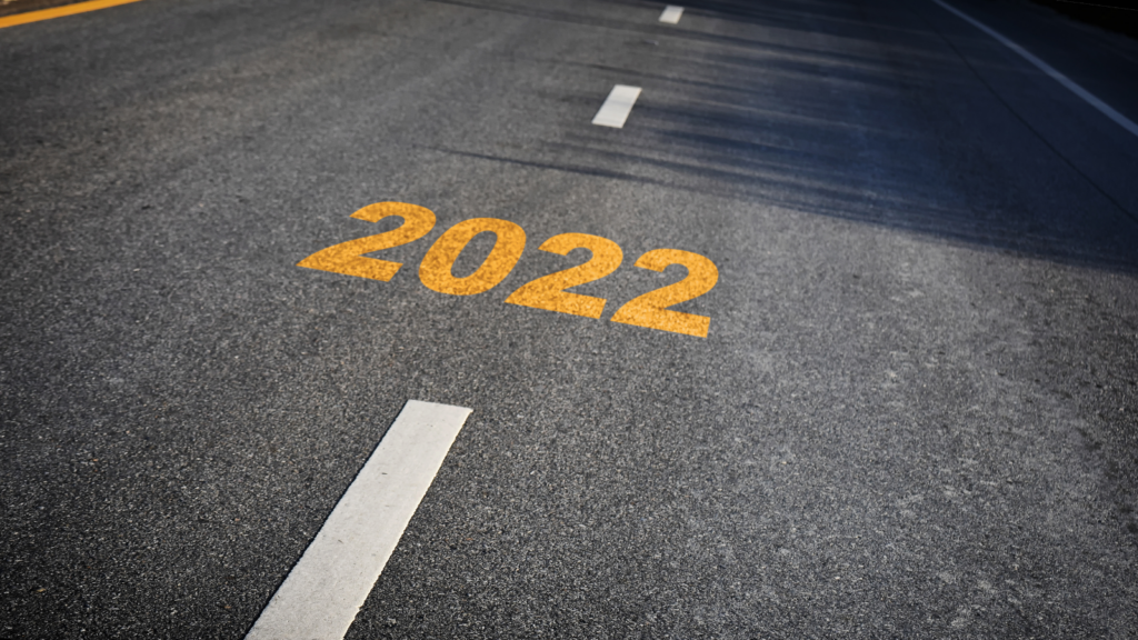 A photo of a roadway with '2022' spray painted on to it.